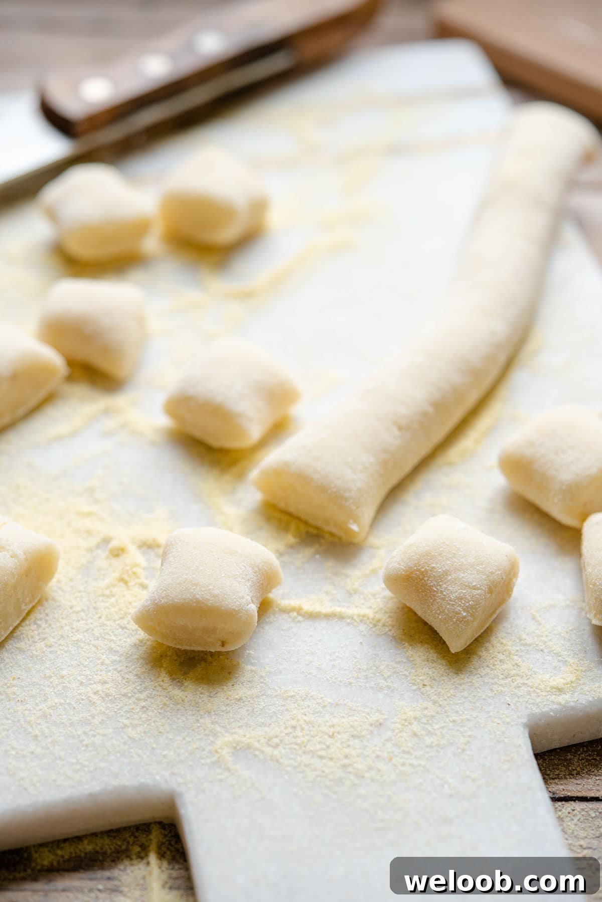 A close up of gnocchi on a cutting board
