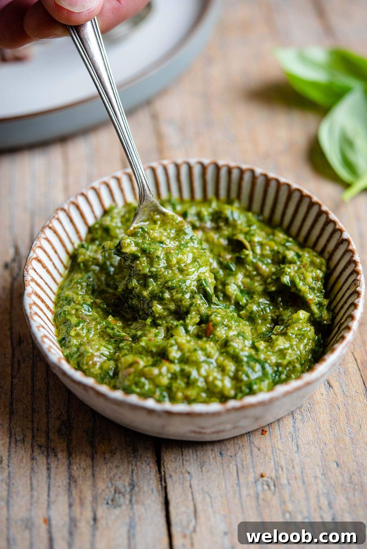 A close up of salsa verde in a ramekin