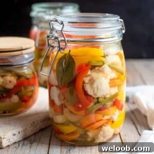 A close up of a jar of giardiniera vegetables