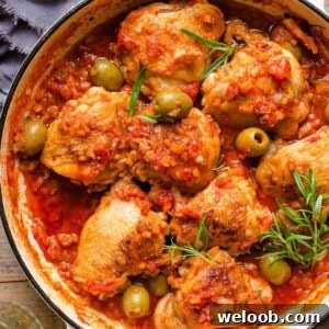 A close up of chicken cacciatore in a skillet