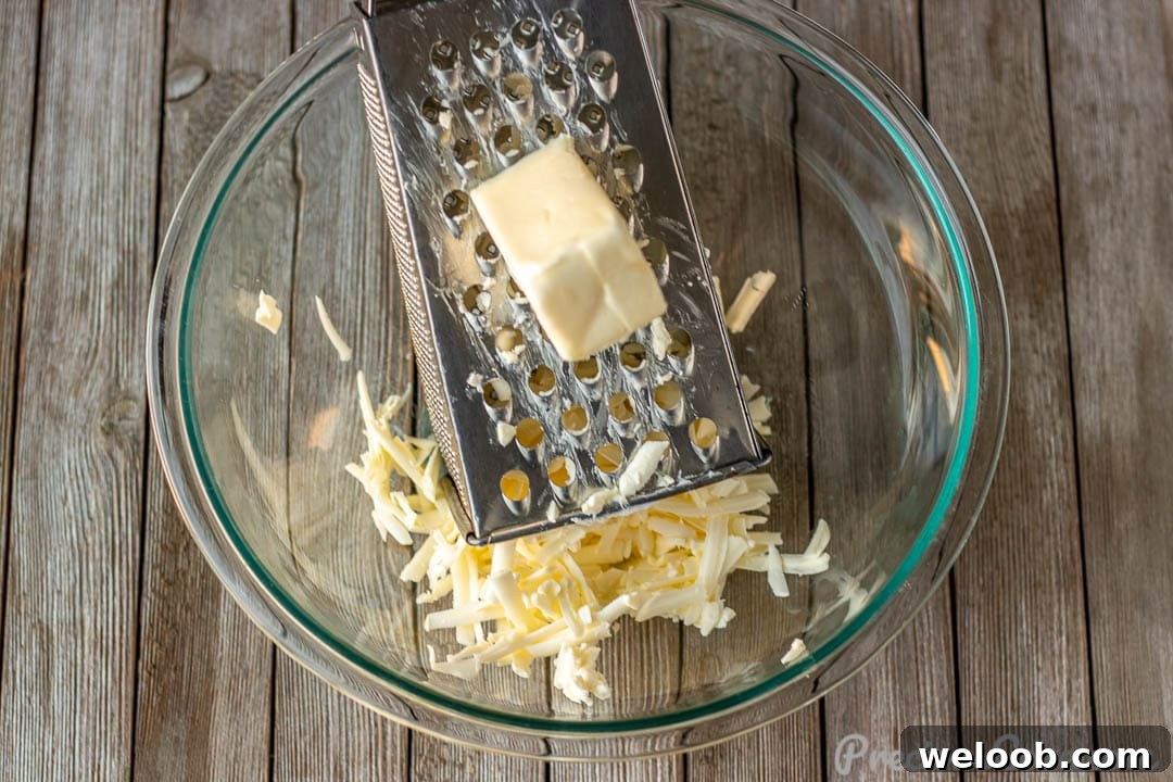 Grated butter in mixing bowl