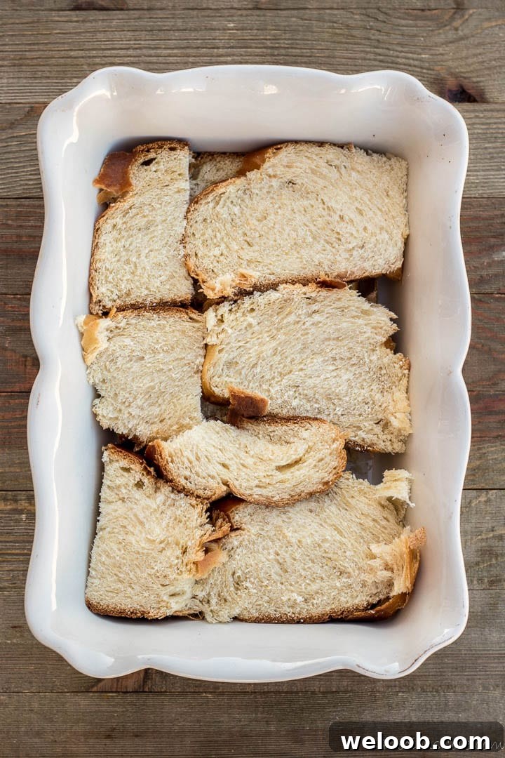 Arranged Slices of bread in baking pan