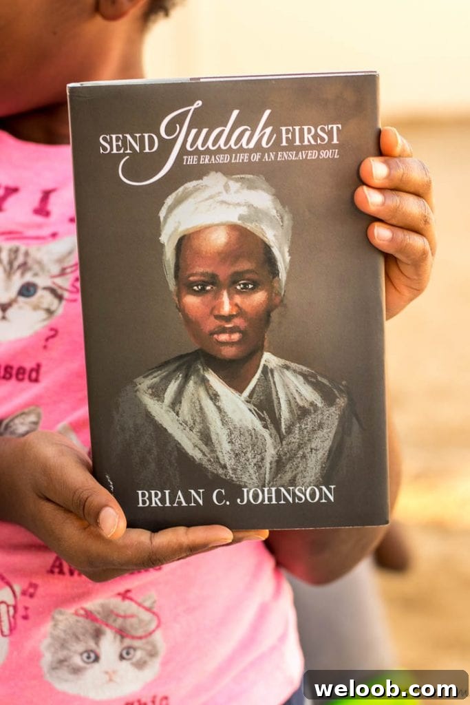 Hands holding Send Judah First Book