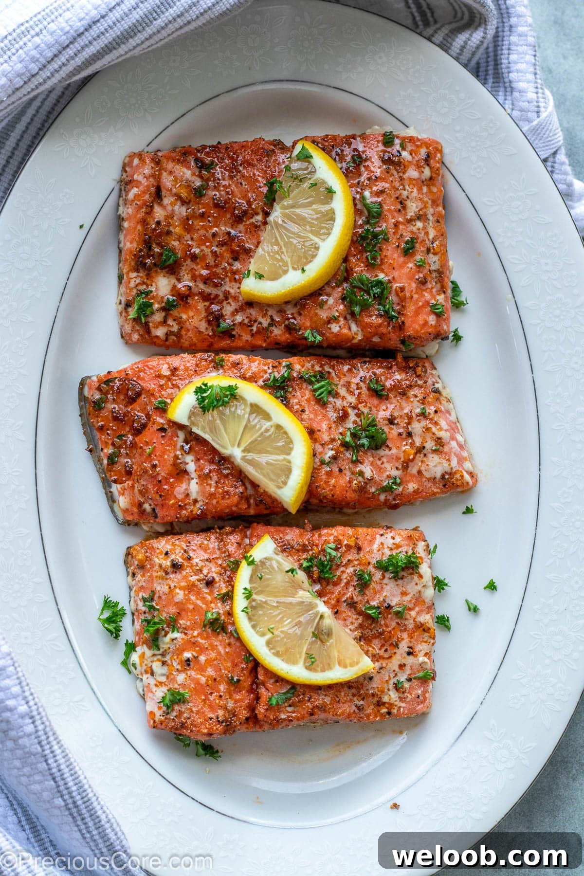 Baked Cajun Salmon on a white serving platter.