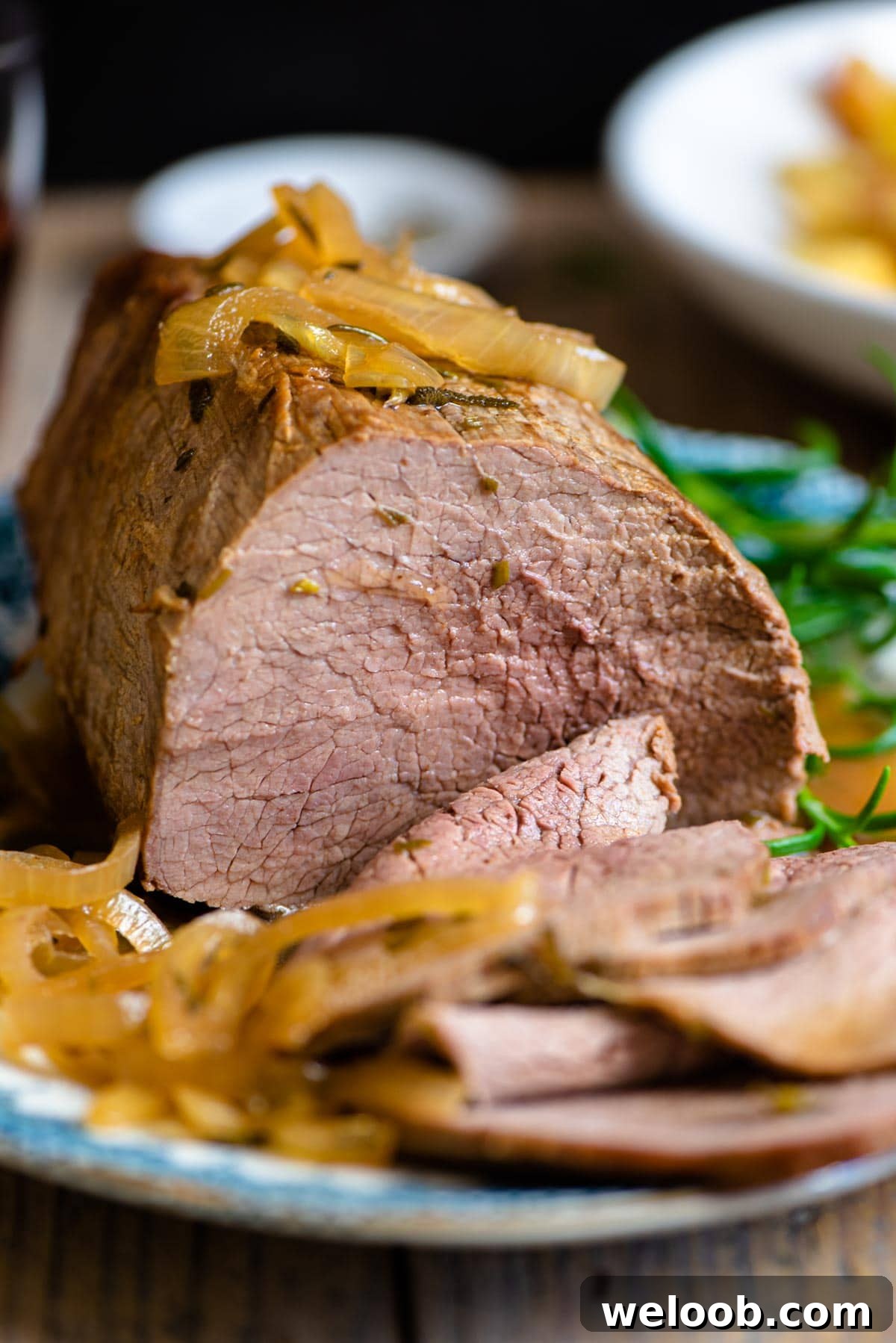 A close up of Italian roast beef with onions