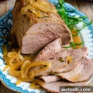 A close up of roast beef on a plate