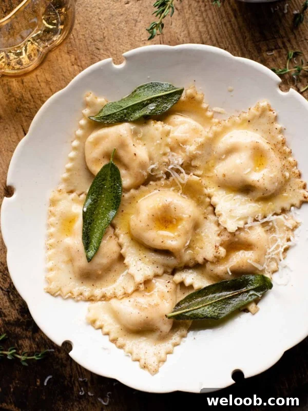An overhead shot of butternut squash ravioli in a white bowl sitting on a wooden serving board.