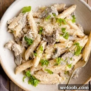 A close up of pasta alla boscaiola in a bowl