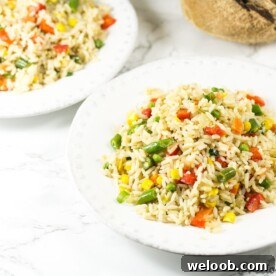 White bowls of coconut fried rice.