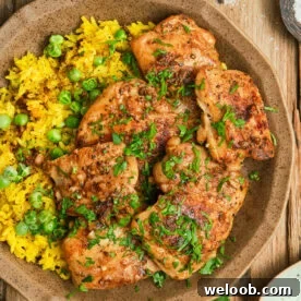 Pan Seared Boneless Chicken Thighs with yellow rice.