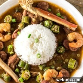 Seafood Gumbo and rice on a plate.