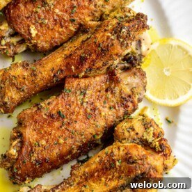 Lemon pepper turkey wings on a serving platter.