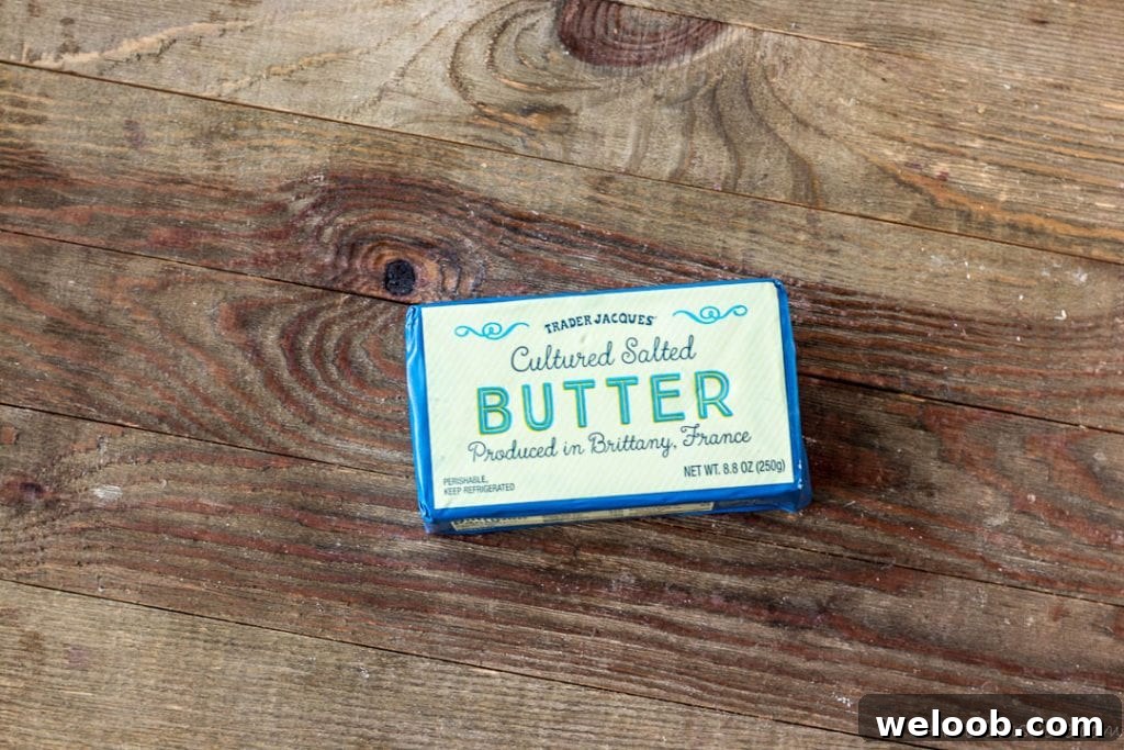 Block of French butter on a wooden board