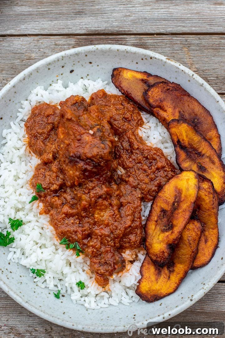Bowl of African chicken stew on rice.