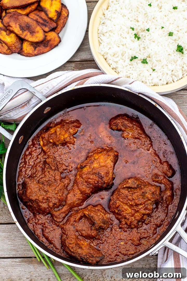Bowls of African tomato stew, rice and plantains