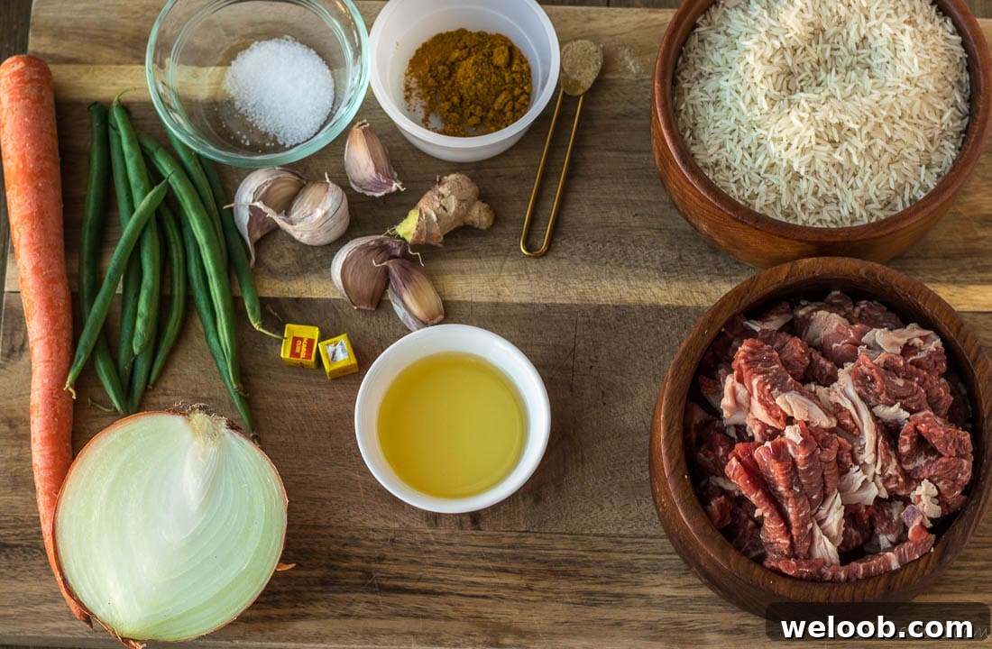 Beef rice, spices and oil on a chopping board.