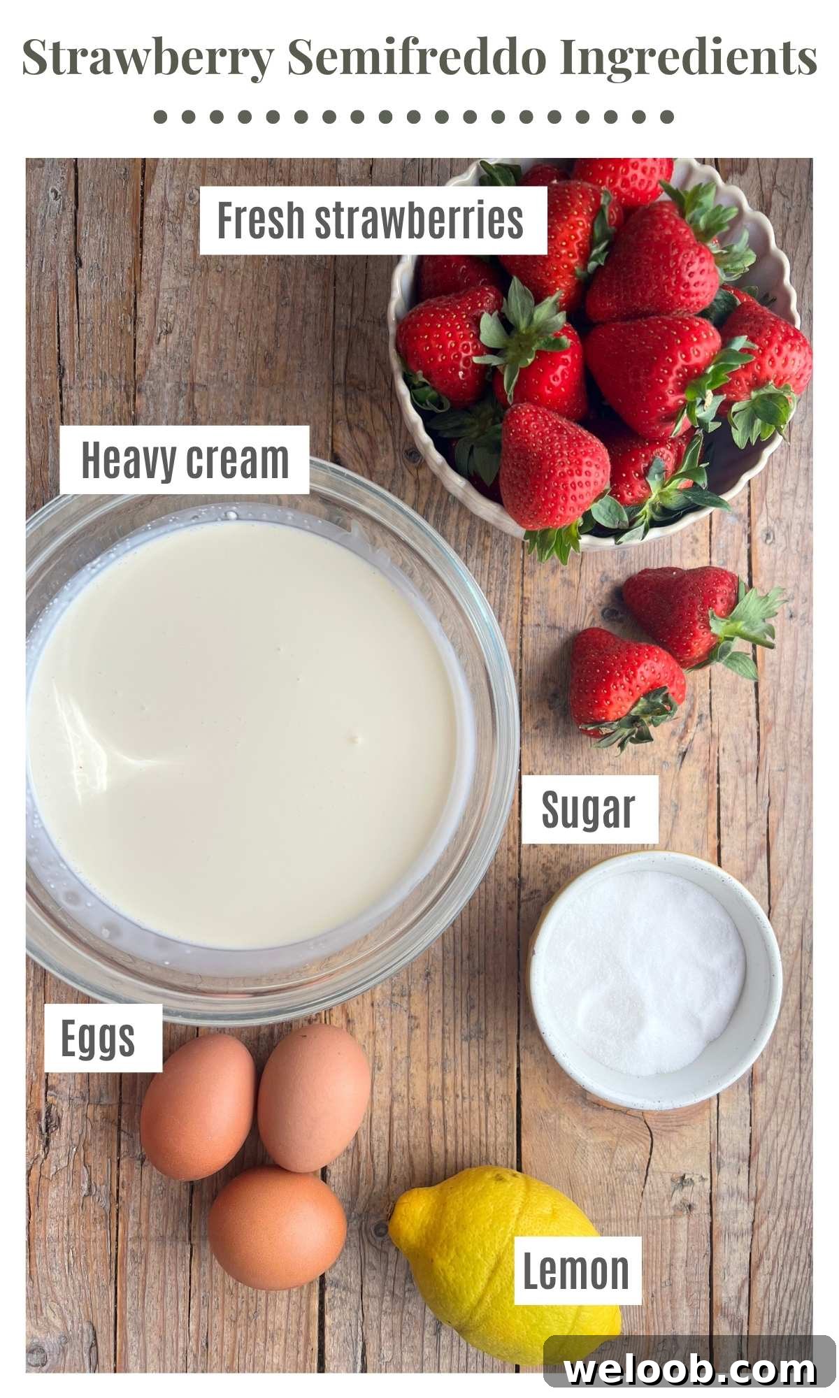 Silky Strawberry Semifreddo with Fresh Strawberry Sauce 3 An overhead shot of all the ingredients needed to make strawberry semifreddo laying on a rustic wooden surface. Strawberries, cream, sugar, eggs and lemon.