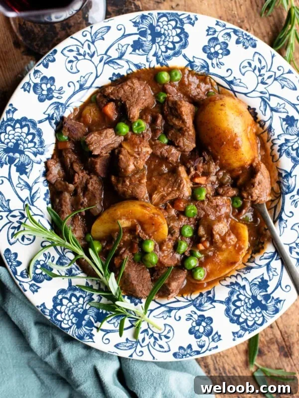 Beef Tramezzino with Radicchio, Cheese and Porchetta 9 Italian beef stew with potatoes and peas in a blue and white floral bowl with rosemary and red wine at the side.