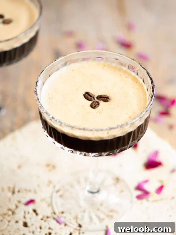 An espresso martini with 3 coffee beans on top