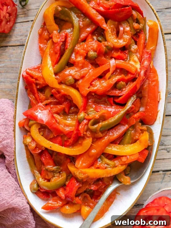 How to Make Italian Marinated Roasted Bell Peppers 5 Peppers in tomato sauce on a serving plate