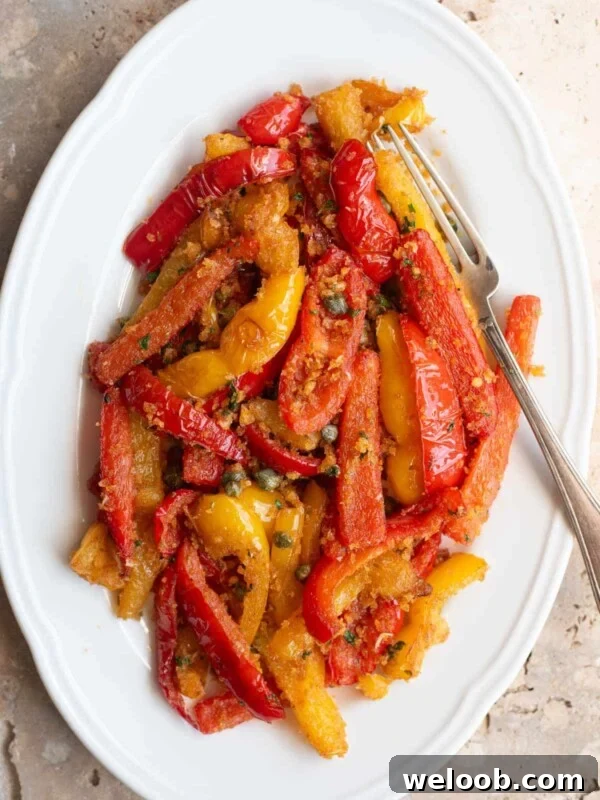 How to Make Italian Marinated Roasted Bell Peppers 6 An overhead shot of Peperoni Ammollicati (Italian peppers and breadcrumbs) on a white serving plate.