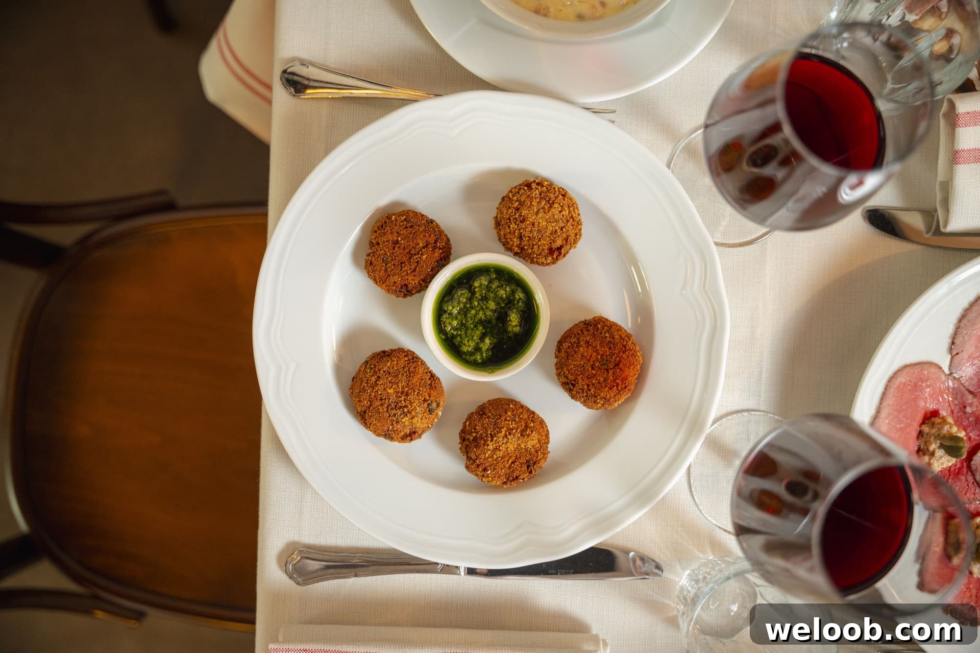 Mondeghili on a plate in a restaurant.