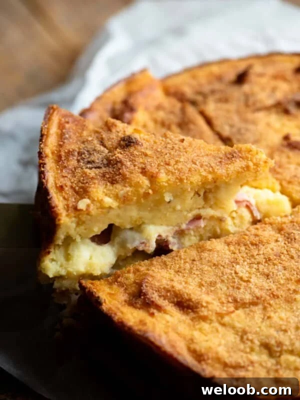 A close up of a slice of Neapolitan potato cake.